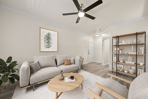 a living room with a couch and a ceiling fan